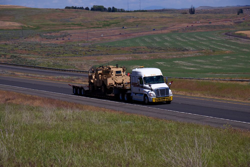 a tank is transported on a truck